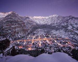 <p>Skies clear at twilight after several days of snow storms in Ouray, Colorado in the San Juan Mountains - December.</p>